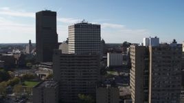 5.7K aerial stock footage of Five Star Bank Plaza behind apartment building in Downtown Rochester, New York Aerial Stock Footage | DX0002_208_006