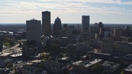 5.7K aerial stock footage of ascending past the city skyline, Downtown Rochester, New York Aerial Stock Footage | DX0002_208_014