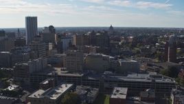 5.7K aerial stock footage descend and flyby office buildings and parking garage, Downtown Rochester, New York Aerial Stock Footage | DX0002_208_015