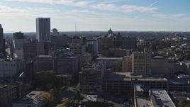 5.7K aerial stock footage of passing office buildings and parking garage, Downtown Rochester, New York Aerial Stock Footage | DX0002_208_017