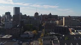 5.7K aerial stock footage flying by office buildings and parking garage by East Avenue, Downtown Rochester, New York Aerial Stock Footage | DX0002_208_019