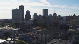 5.7K aerial stock footage of the city skyline seen while ascending near Five Star Bank Plaza, Downtown Rochester, New York Aerial Stock Footage | DX0002_208_020