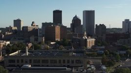 5.7K aerial stock footage of skyscrapers and office towers behind apartment building, Downtown Rochester, New York Aerial Stock Footage | DX0002_209_001