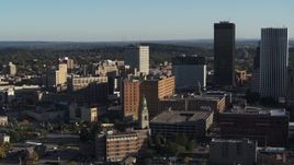 5.7K aerial stock footage stationary view of apartment building near high-rises, Downtown Rochester, New York Aerial Stock Footage | DX0002_209_004