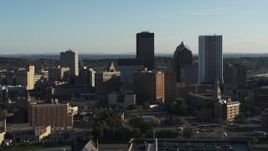 5.7K aerial stock footage of flying by apartment building and skyline, Downtown Rochester, New York Aerial Stock Footage | DX0002_209_009