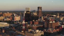 5.7K aerial stock footage of flying by office buildings at sunset, Downtown Rochester, New York Aerial Stock Footage | DX0002_209_026