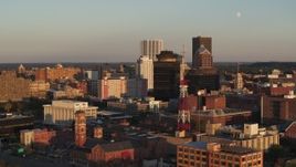 5.7K aerial stock footage orbit First Federal Plaza, office buildings, and a radio tower at sunset, Downtown Rochester, New York Aerial Stock Footage | DX0002_209_032
