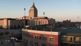5.7K aerial stock footage fly over Frontier Field toward college and Kodak Tower at sunset, Rochester, New York Aerial Stock Footage | DX0002_209_035