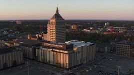 5.7K aerial stock footage of orbiting a college and Kodak Tower at sunset, Rochester, New York Aerial Stock Footage | DX0002_209_037