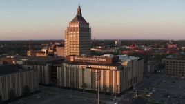 5.7K aerial stock footage of orbiting Kodak Tower and a college at sunset, Rochester, New York Aerial Stock Footage | DX0002_209_039