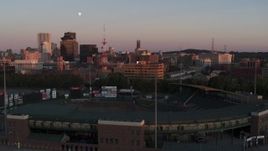 5.7K aerial stock footage fly over baseball stadium to approach radio tower and office buildings at sunset, Downtown Rochester, New York Aerial Stock Footage | DX0002_209_048