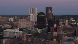 5.7K aerial stock footage of flying by First Federal Plaza and office buildings at twilight, Downtown Rochester, New York Aerial Stock Footage | DX0002_210_001