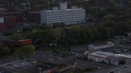 5.7K aerial stock footage of tracking a train at twilight, Downtown Rochester, New York Aerial Stock Footage | DX0002_210_003