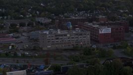 5.7K aerial stock footage of orbiting a brick factory building and water tower at twilight, Downtown Rochester, New York Aerial Stock Footage | DX0002_210_004