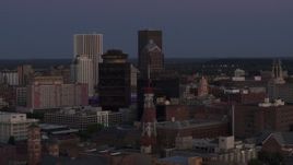 5.7K aerial stock footage of First Federal Plaza, radio tower, and Legacy Tower at twilight, Downtown Rochester, New York Aerial Stock Footage | DX0002_210_006