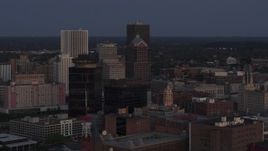 5.7K aerial stock footage focus on Legacy Tower at twilight during orbit of skyline, Downtown Rochester, New York Aerial Stock Footage | DX0002_210_007