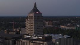 5.7K aerial stock footage descend while focused on the top of Kodak Tower at twilight, Rochester, New York Aerial Stock Footage | DX0002_210_010