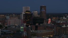 5.7K aerial stock footage descend and orbit the city skyline behind radio tower, First Federal Plaza at twilight, Downtown Rochester, New York Aerial Stock Footage | DX0002_210_018