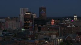 5.7K aerial stock footage of flying by the First Federal Plaza, The Powers Building at twilight, Downtown Rochester, New York Aerial Stock Footage | DX0002_210_020