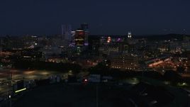 5.7K aerial stock footage of a wide orbit of the city's skyline at night, Downtown Rochester, New York Aerial Stock Footage | DX0002_210_025