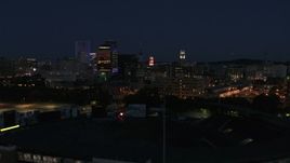 5.7K aerial stock footage of office buildings seen from baseball stadium at night, Downtown Rochester, New York Aerial Stock Footage | DX0002_210_027
