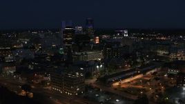 5.7K aerial stock footage ascend while focused on office buildings and skyline at night, Downtown Rochester, New York Aerial Stock Footage | DX0002_210_033