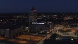 5.7K aerial stock footage fly away from Kodak Tower and college at night, and descend, Rochester, New York Aerial Stock Footage | DX0002_210_036
