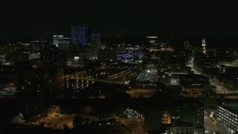5.7K aerial stock footage of the Genesee River and skyline at night, Downtown Rochester, New York Aerial Stock Footage | DX0002_210_037