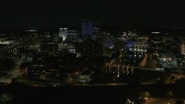 5.7K aerial stock footage stationary view of the Genesee River and skyline at night, Downtown Rochester, New York Aerial Stock Footage | DX0002_210_039