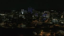 5.7K aerial stock footage of flying by the Genesee River and skyline at night, Downtown Rochester, New York Aerial Stock Footage | DX0002_210_040