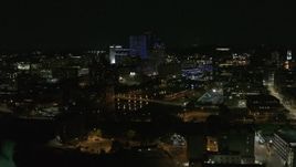 5.7K aerial stock footage of flying away from the Genesee River and skyline at night, Downtown Rochester, New York Aerial Stock Footage | DX0002_210_041
