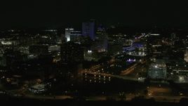 5.7K aerial stock footage of approaching the city's skyline beside the Genesee River at night, Downtown Rochester, New York Aerial Stock Footage | DX0002_210_043