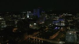 5.7K aerial stock footage of orbiting the city's skyline beside the Genesee River at night, Downtown Rochester, New York Aerial Stock Footage | DX0002_210_044