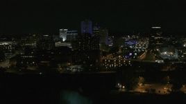 5.7K aerial stock footage descend and orbit of city's skyline by the Genesee River at night, Downtown Rochester, New York Aerial Stock Footage | DX0002_210_047