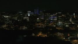 5.7K aerial stock footage of circling the city's skyline by the Genesee River at night, Downtown Rochester, New York Aerial Stock Footage | DX0002_210_048