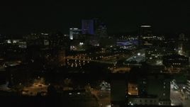 5.7K aerial stock footage of flying by the Genesee River and skyline at night, Downtown Rochester, New York Aerial Stock Footage | DX0002_210_050