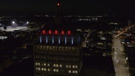 5.7K aerial stock footage of approaching the top of Kodak Tower at night, Rochester, New York Aerial Stock Footage | DX0002_210_055