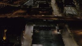 5.7K aerial stock footage of light traffic on the Inner Loop at night, Downtown Rochester, New York Aerial Stock Footage | DX0002_210_057