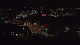 5.7K aerial stock footage of approaching a brewery at night, Rochester, New York Aerial Stock Footage | DX0002_210_061