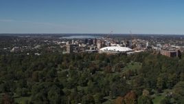 5.7K aerial stock footage of flying away from Carrier Dome, Downtown Syracuse in the background, New York Aerial Stock Footage | DX0002_211_001