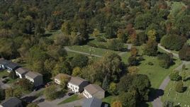 5.7K aerial stock footage approach and orbit graves at Morningside Cemetery near homes in Syracuse, New York Aerial Stock Footage | DX0002_211_007