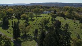 5.7K aerial stock footage of descending near gravestones at Morningside Cemetery in Syracuse, New York Aerial Stock Footage | DX0002_211_011