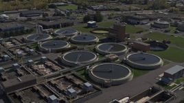 5.7K aerial stock footage of orbiting a sewage treatment plant in Syracuse, New York Aerial Stock Footage | DX0002_211_016