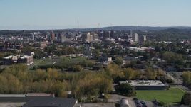5.7K aerial stock footage of Downtown Syracuse, New York seen from green fields Aerial Stock Footage | DX0002_211_018