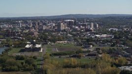 5.7K aerial stock footage of flying by Downtown Syracuse, New York seen from across the city Aerial Stock Footage | DX0002_211_019