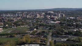 5.7K aerial stock footage of passing by Downtown Syracuse, New York seen from across the city Aerial Stock Footage | DX0002_211_020
