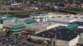 5.7K aerial stock footage of flying away from a shopping mall in Syracuse, New York Aerial Stock Footage | DX0002_211_026