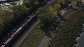 5.7K aerial stock footage of a train on the shore of a lake in Syracuse, New York Aerial Stock Footage | DX0002_211_032