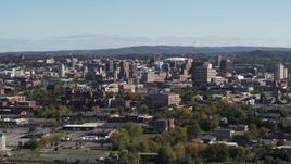 5.7K aerial stock footage of passing by the city's downtown area, Downtown Syracuse, New York Aerial Stock Footage | DX0002_212_003