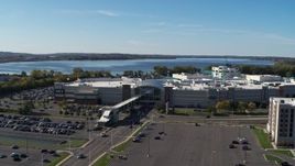 5.7K aerial stock footage of orbiting the Destiny USA shopping mall with lake in the background, Syracuse, New York Aerial Stock Footage | DX0002_212_019